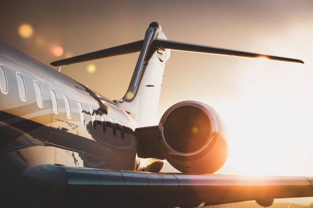 Close-up view of a sleek private jet at sunset, highlighting luxury air travel and charter services by Fly Avcare