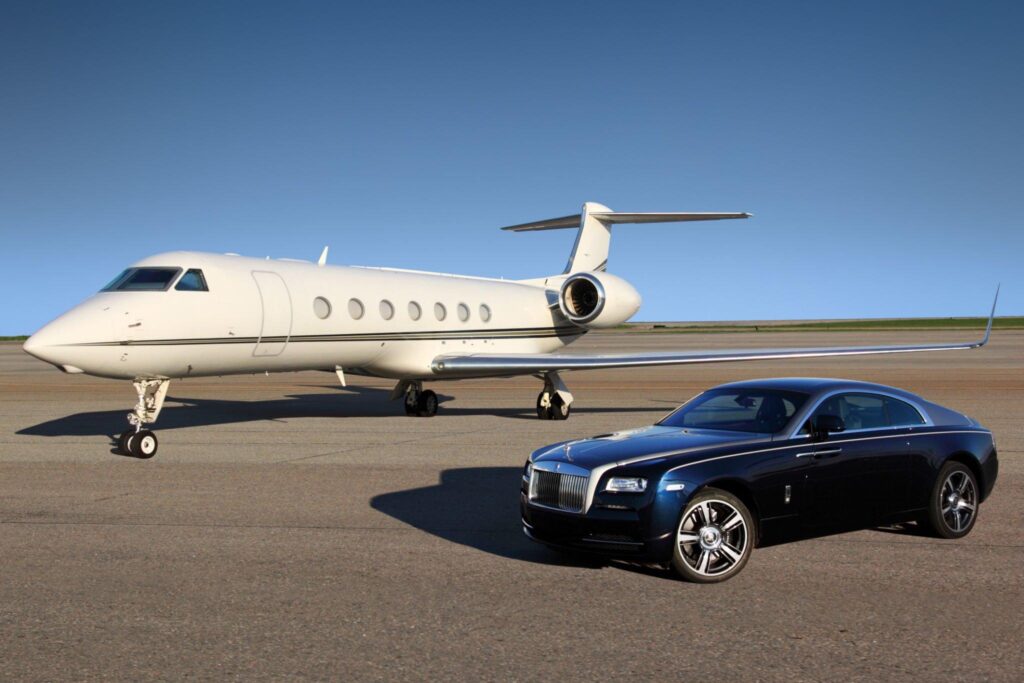 Chauffeured VIP transfer in luxury car beside a private jet