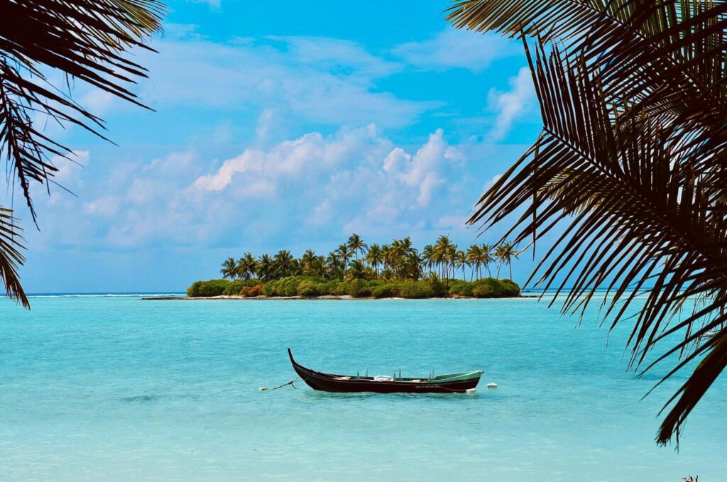 Tropical island in Lakshadweep with turquoise water and palm trees