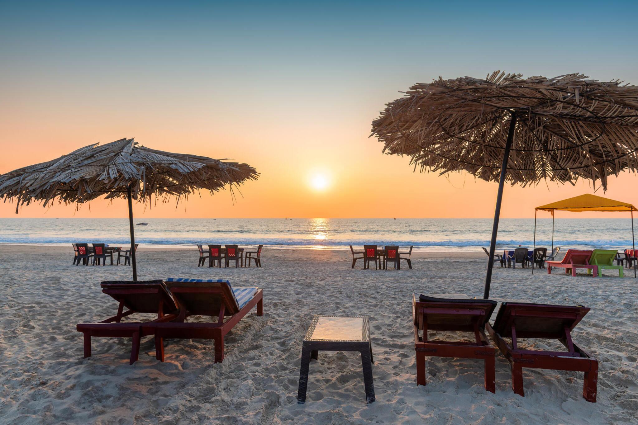 Private jet charter service to Goa with sunset beach view