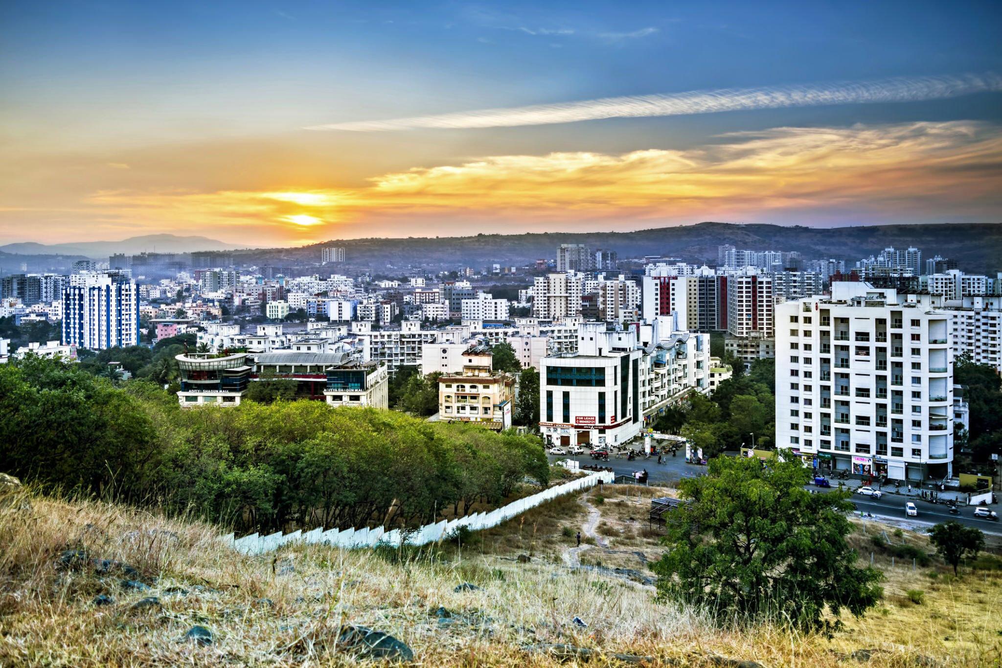 Panoramic view of Nanded city with modern buildings and sunset sky in Maharashtra, India