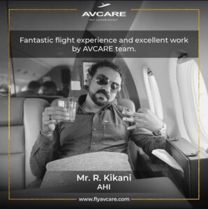 Mr. D. Khan giving a thumbs up inside a private jet