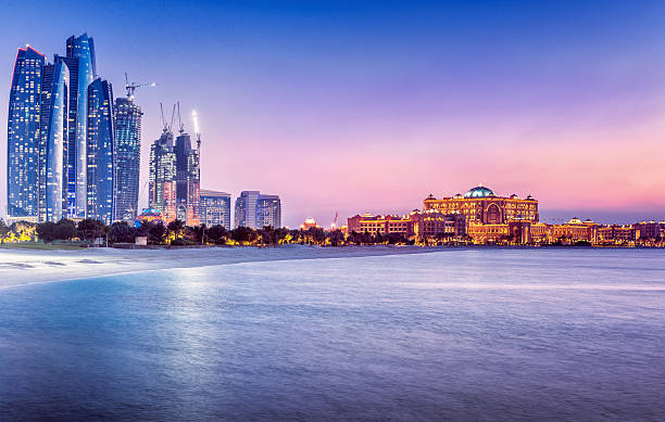 Skyline of Abu Dhabi with waterfront at sunset
