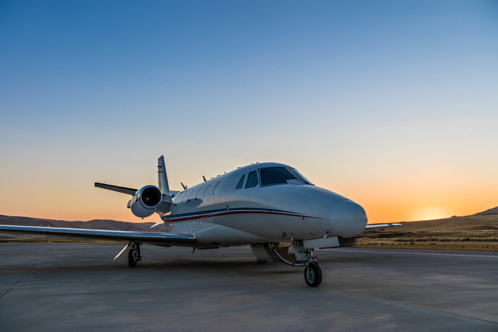 Private jet on the runway at sunset, ready for takeoff under clear skies