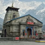 Kedarnath Temple with snow-capped mountains in the background