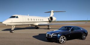 Chauffeured VIP transfer in luxury car beside a private jet