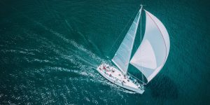 Elegant white sailboat cruising near Mumbai gateway